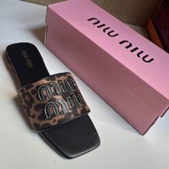 Miu Miu Black Designer Slides with Statement Buckle – Elegant & Trendy