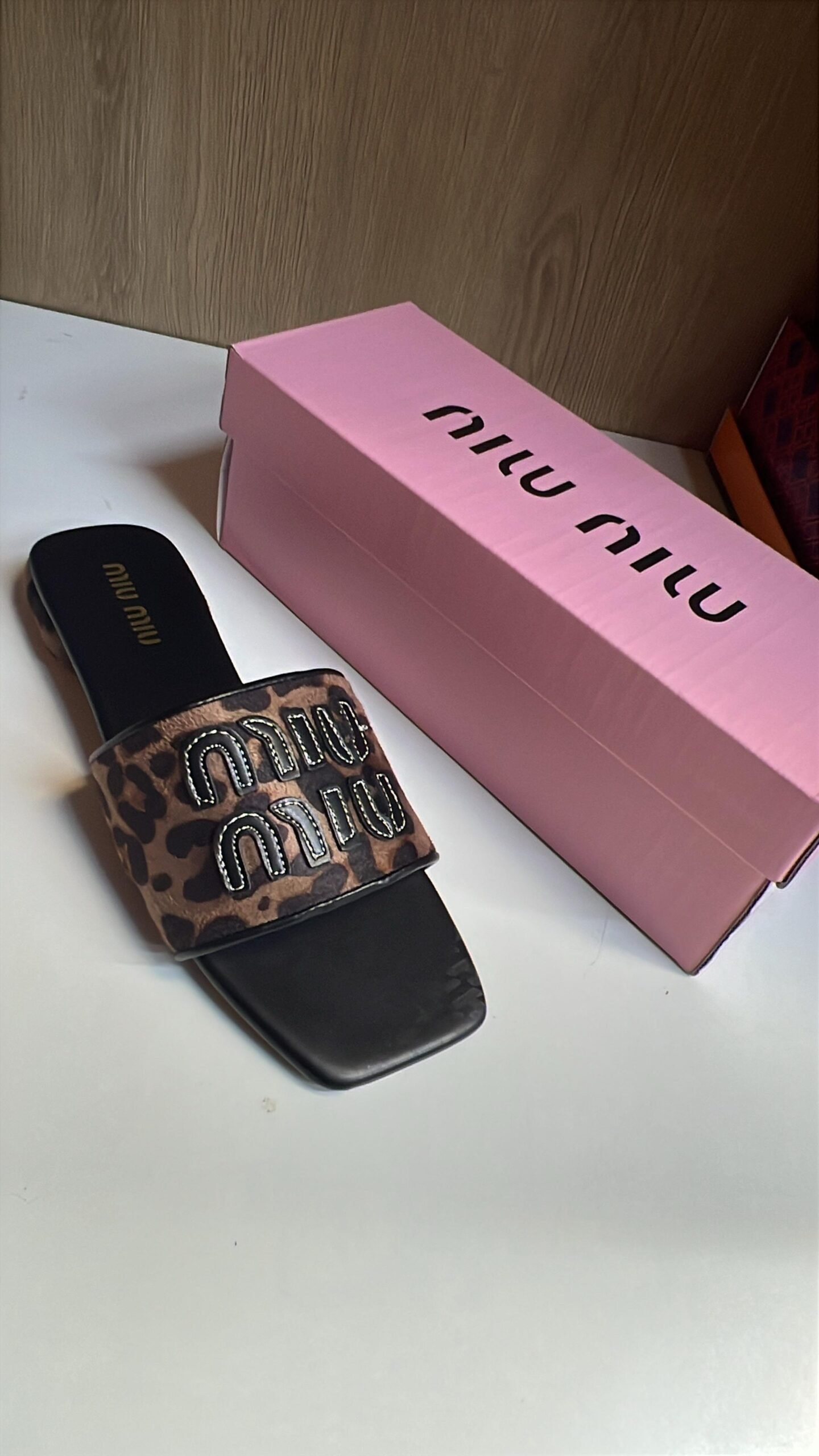 Miu Miu Black Designer Slides with Statement Buckle – Elegant & Trendy