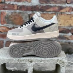 Nike - Air Force 1 Sneakers – Beige with Black Swoosh